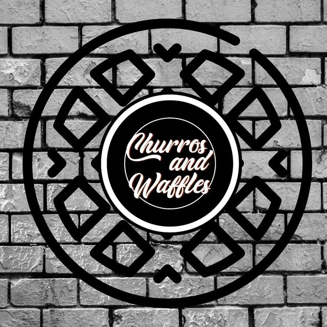 Logo de Churros and Waffles en neón sobre el muro de ladrillo del local